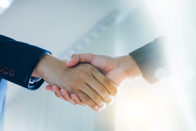 Trusted,Partner.,Businessmen,Making,Handshake,With,Partner,,Greeting,,Dealing,,Merger